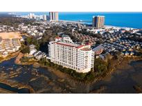 Beautiful aerial view of coastal condo building and surrounding neighborhood near the ocean at 9547 Edgerton Dr. # 204, Myrtle Beach, SC 29572