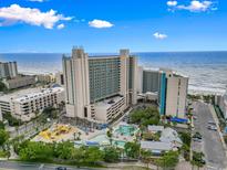 Expansive aerial view showcasing the oceanfront resort, pools, and surrounding Myrtle Beach area at 205 N 74Th Ave. N # 805, Myrtle Beach, SC 29572