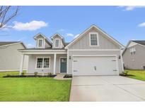 Charming single-Gathering home featuring a manicured lawn, and an attached two-car garage at 3332 Little Bay Dr., Conway, SC 29526