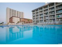 Resort-style pool with clear blue water surrounded by multiple story condo buildings at 5905 S Kings Hwy. # 327 A, Myrtle Beach, SC 29575