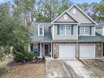 Charming townhome with a well-manicured front yard and two-car garage in a desirable neighborhood at 759 Painted Bunting Ct. # A, Murrells Inlet, SC 29576