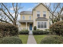 Charming two-story home featuring a welcoming front porch and professionally landscaped yard at 10 Orchard Ave., Murrells Inlet, SC 29576