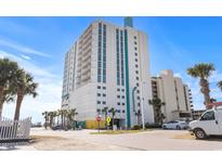 A beautiful exterior shot of a high-rise condo building on a bright, sunny day in a resort community at 2301 S Ocean Blvd. # 1401, North Myrtle Beach, SC 29582
