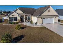 Charming single-Gathering home with a well-manicured lawn and inviting curb appeal at 302 Camrose Way, Myrtle Beach, SC 29588