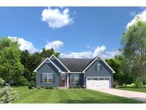 Charming single-Gathering home featuring blue siding, a red front door, and an attached two-car garage at 747 Indigo Bay Circle, Myrtle Beach, SC 29579