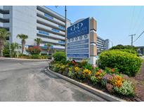 Harborgate Resort & Marina sign, showcasing services, surrounded by vibrant flowers at 2100 Sea Mountain Hwy. # 530, North Myrtle Beach, SC 29582