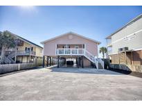 Charming stilt home with covered parking and outdoor space at 2402 N Ocean Blvd., North Myrtle Beach, SC 29582