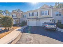 Charming two-story townhome with attached garages and well-manicured landscaping in a desirable community at 2450 Marsh Glen Dr. # 812, North Myrtle Beach, SC 29582