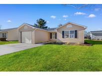 Charming single-story home features a well-manicured lawn, attached garage, and inviting curb appeal at 2483 Morlynn Dr., Myrtle Beach, SC 29577