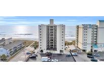 View of a beachfront condo with a parking area near the beach and ocean views at 2501 S Ocean Blvd. # 206, North Myrtle Beach, SC 29582