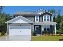 Charming two-story home featuring gray siding, white trim, and a well-maintained front yard at 344 Rookroost Circle, Conway, SC 29526