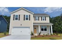Charming two-story home with beige siding, black shutters, and an attached two-car garage at 348 Rookroost Circle, Conway, SC 29526