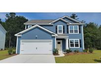 Charming two-story home with blue siding, black shutters, and a two-car garage at 352 Rookroost Circle, Conway, SC 29526