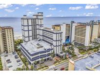 An aerial view showcases a grand resort with ample parking, towering buildings, and a stunning ocean backdrop at 5308 N Ocean Blvd. # 2108, Myrtle Beach, SC 29577