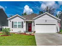 Charming single-story home featuring a well-manicured lawn and a welcoming red front door at 583 Meadowgrass Ct., Myrtle Beach, SC 29588