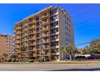 A multi story condominium building with private balconies on each unit and manicured landscaping at 7603 N Ocean Blvd. # 4E, Myrtle Beach, SC 29572