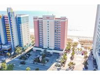 Beautiful aerial view of a resort featuring palm trees, an ocean view, and ample parking at 1604 N Ocean Blvd. # 605, Myrtle Beach, SC 29577