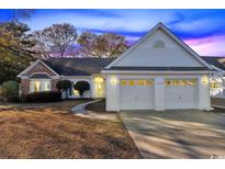 Charming single-story home with a two-car garage and well-maintained landscaping at 1639 Coventry Rd., Surfside Beach, SC 29575