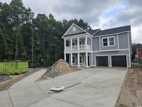 Charming two-story home with a double garage and inviting double porch at 1808 Sunshine Ct., North Myrtle Beach, SC 29582