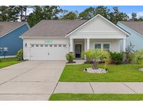 Charming single-story home featuring a well-manicured lawn and a welcoming front porch at 2568 Goldfinch Dr., Myrtle Beach, SC 29577