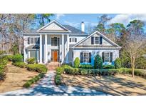 Stately home featuring a columned front facade and landscaped grounds at 3369 Collins Creek Dr., Murrells Inlet, SC 29576