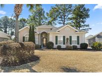 Charming single-story home with a well-manicured front yard and inviting curb appeal at 356 Carriage Lake Dr., Little River, SC 29566