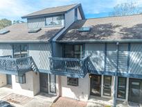 Two-story townhouse with blue siding, skylights, and private balconies in a residential community at 504 30Th Ave. N # 3, Myrtle Beach, SC 29577