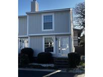 Charming townhouse with a neat front yard and a well-maintained exterior with beautiful windows and door at 6921 Porcher Dr. # F, Myrtle Beach, SC 29572