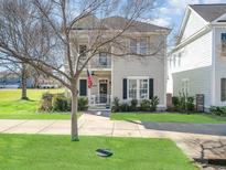 Charming home with a welcoming front porch, white picket fence, and neatly manicured lawn, perfect for curb appeal at 823 Howard Ave., Myrtle Beach, SC 29577