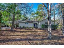 Charming single story home with lush, mature landscaping and a covered parking area at 935 Little Creek Rd., Myrtle Beach, SC 29572