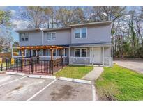 Charming townhome featuring a covered patio with pergola and designated parking spaces at 306 Cedar St. # Apt 12, Myrtle Beach, SC 29577