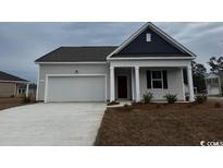 Charming single-story home with gray siding, covered porch, and a two-car garage at 343 Glade Ct., Loris, SC 29569