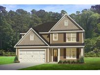 Charming two-story home featuring a white garage door, brown siding, and lovely trim details at 374 Glacier Way, Conway, SC 29526