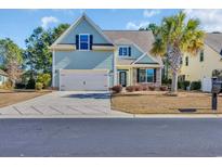 Charming home with a well-manicured lawn, two-car garage, and beautiful landscaping at 132 Summerlight Dr., Murrells Inlet, SC 29576