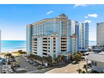 Beautiful oceanfront resort with a parking garage, blue skies, and lush greenery at 2501 S Ocean Blvd. # 1103, Myrtle Beach, SC 29577