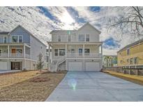 Inviting two-story home featuring a double garage, covered porch and traditional design at 319 Crossing Ct., Myrtle Beach, SC 29588