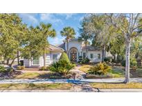 Stunning single-story home showcasing a landscaped yard, tiled roof, and decorative doorway at 8068 Cortona Dr., Myrtle Beach, SC 29572