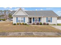 Charming single-story home with blue shutters and a cozy front porch at 2601 Rosehip Ct., Conway, SC 29527