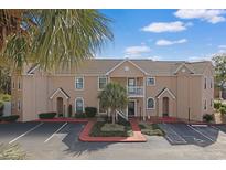 Attractive condo building with well maintained landscaping and reserved parking spots at 340 Lands End Blvd. # 18, Myrtle Beach, SC 29572