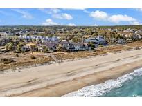 An aerial view showcases beachfront homes with beach access and ocean views at 363 Debordieu Blvd. # Nec-1, Georgetown, SC 29440