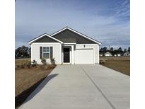 Charming single-story home featuring a symmetrical facade, black shutters, and a well-manicured lawn at 457 Acosta Circle, Conway, SC 29527