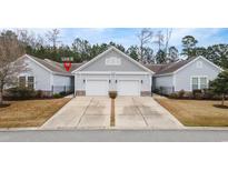 Charming home featuring a two-car garage, well-manicured lawn, and welcoming curb appeal at 1517 Palmina Loop # B, Myrtle Beach, SC 29588