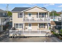 Two-story home featuring double balconies and neutral-colored siding at 6001-L11 South Kings Hwy., Myrtle Beach, SC 29575