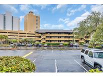 Exterior of condo building with parking lot and multiple floors at 9501 Shore Dr. # D-234, Myrtle Beach, SC 29572