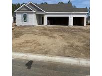 Charming single-story home with gray siding and a spacious three-car garage awaiting personalization at 183 Glengrove Lane, Murrells Inlet, SC 29576