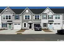 New townhomes show modern exterior, garages, and neutral paint scheme at 2053 Nw Parow Ln Nw # B, Calabash, NC 28467