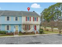 Charming townhome with a red door, red shutters, and guest parking available at 2970 Old Bryan Dr. # A5, Myrtle Beach, SC 29577