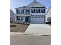 Charming two-story home with blue siding, black shutters, and a spacious two-car garage at 347 Broughton Dr., Myrtle Beach, SC 29579