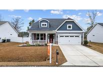 Charming single-Gathering home with a well-maintained lawn, two-car garage, and lovely curb appeal at 395 Dunbarton Ln., Conway, SC 29526