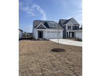 Charming two-story home with a well-manicured lawn and inviting entrance at 619 Castle Ct., Myrtle Beach, SC 29579